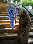 People putting colored (spices?) on the steps of the walkway