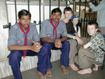A viewing of the god is called "darshan."  There are all sorts of ways to arrange darshan.  The more you pay, the faster you can get through the lines.  If you pay nothing at all, the wait is sometimes measured in days.  Paying 50 rupees gets one a particular time and about an hour and a half wait.  Getting an opportunity to pay more requires a letter from someone or a contribution to the TTD.  Tote is talking with some of the scouts who help keep things organized.  You can't wear shoes in the temple.  