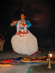Characters have their fingers fitted with long silver nails to accentuate hand gestures.   Woman, brahmins and sages excepted.  This dancer is demonstrating gestures.  Later, when he plays a woman, he has taken off his fingernails.  