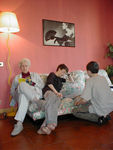 Lounging around.  Grandma is reading Maggie's book and the boys are engaged in some Star Wars madness