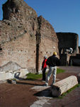 One of the walls of the Aula Regia part of the domus Flavia.  Romulus started Rome on Palatine Hill.  For centuries Romans built houses here because it was far from the marshlands and the heat and noise of crowds but relatively close to the Forum.  After Augustus had consolidated his power, he built a house here to connect himself with the legend of Romulus and help make his emperorship, a novel institution, more secure.  This room, 30 meters high, was a sort of throne room.