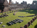 This was a "small" stadium in the emperor's palace.  Beyond the stadium are the ruins of Septimus Severus's extension of the palace.  He ran out of hill so he created level space by constructing it using huge arches to support it.  