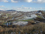The day after the snow we have beautifully clear weather.  The air is clear enough for us to see buildings and windmills on top of the high mountains 