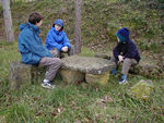 Sitting at a moss-covered table we found in somebody's side yard.  They weren't home.
