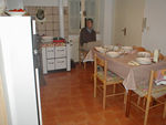 Mark in the kitchen.  The real stove is behind the fridge.