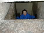 Duncan: Tote's looking through a little window that was at the very bottom of the wall.  Maggie took a picture of him there.