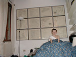 Tote in his bed beneath charts of the Venice area