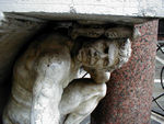 Hunchback of the Rialto.  He's part of the stairs up to the top of the pillar on the right.  That pillar and another in St. Mark's is where the laws were read before they went into force.