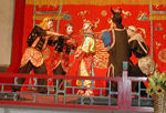 These guys are trying, without success, to cut off the monkey god's head.  We don't know why they were trying to cut off his head.