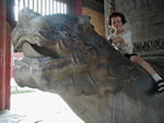 Maggie riding a giant tortoise