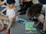 Maggie painting.  Though she was obviously busy, she was interrupted four times by people who wanted her to come with them to pose for a photo.  She complied, though she must be sick of the being in photos and was certainly unhappy to be interrupted.  