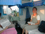 On the train.  We're traveling "hard sleeper," essentially second-class sleepers.  They were spotless, run by a professional crew, and a wonderful (though not very private way) to travel.  