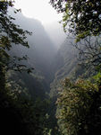 Nice view.  Emei Shan is really quite steep and the path several times threaded its way across very narrow saddles edged by sheer cliffs.
