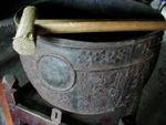 A "bell" which is often sounded each time a devotee touches his or her head to the ground before a statue