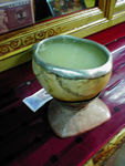 A skull filled with local "beer."  Chang, fermented barley and water, is a traditional offering, supposedly dating back to Tibet's pre-Buddhist religiion.  Skulls of lamas are used for offerings.  The little bill behind the skull is a 5 Jiao note, worth about 6 cents.  Worshippers leave bills, as well as tsampa, butter, rice, and scarves.  Every now and then I chang a 1 Yuan note into 10 Jiao, so the kids can put a note on their favorite statue.  It's kind of fun.
