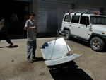 This is a solar teapot cooker.  On the back of the panels is the information that this is a cast "lightweight" solar cooker.