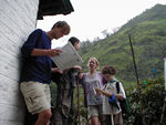 Kris doing the requisite menu examination to see whether to stay at Eagle's Nest or not.  First, we looked at the Dhal Bhat price, then at the price for a beer. On the back are the standard Anapurna Conservation Area Project rules that mark the menu as the standard menu for the whole town. 