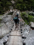Good, that means scary, suspension bridge.  This one moved and the side cable were too far to grab at the end.