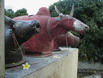 The statues with Maggie's flower