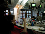 Haircuts at the barber in Luxor.  Even Egyptian barbers have the ballgame on TV