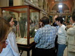 These folks are looking at the Palette of Narmer, commemorating Upper Egypt's  (the southern part of the country - it's UPriver) conquest of Lower Egypt.  It is from 3000 BC.  To put this in perspective, if the 5000 years between when this made and today were a year and this was made in January and today were January of the following year, the last Egyptian dynasty ended in mid-July, the Fall of the Roman Empire would have occurred in mid-September, the Norman Invasion of Britain in October, the Renaissance in November, and the American revolution happened about two weeks ago.  In other words, this artifact relates to a events much, much earlier than what we consider relevant cultural history.