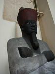 Montuhotep II.  During his reign Luxor (Thebes) became the royal residence and religious center.   The statue was found when Howard Carter, the re-discoverer of King Tut's tomb, rode his horse across the hollow concealing it.  When his horse stumbled, it led to the statue's discovery and the naming of the place where it was found Bab Al-Hossan (the tomb of the horse).