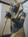 Statue of Tutankhamun.  Tut was probabably a son of Aknenaton.  Tut was married to one of Akhenaton's daughters and became pharaoh when he was 10 or 12.  He reinstated polytheism and reopened temples closed by Akhenaton who had tried to foist monotheism on the country.