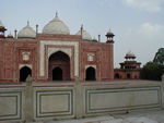 The Jawab (I think) mirrors the mosque which is on the other side.  As Duncan pointed out, Shah Jahan couldn't have flanked the mausoleum with two symmetric mosques, because only one would face Mecca.