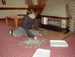 Puzzle man resting his legs in Crianlarich
